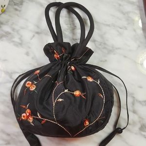 Pretty black/floral satiny drawstring purse in excellent condition!
